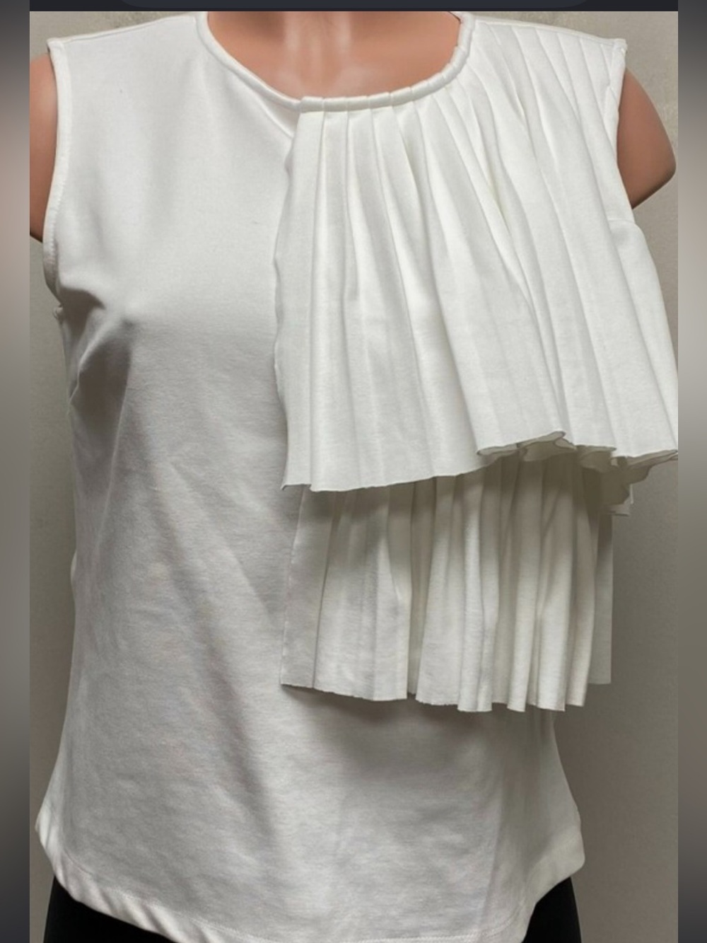 Tahari size Xl top with unique style.   Stretch material -white cream color.